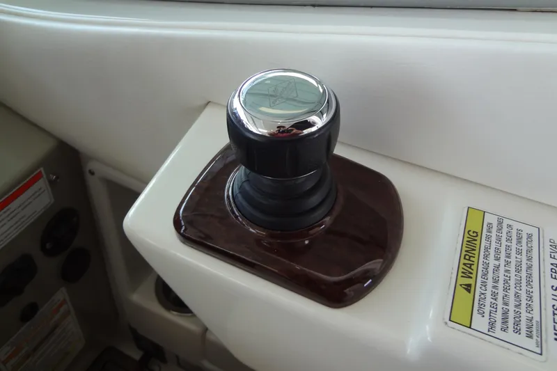 Slide: The Image of Joystick control on 2013 Sea Ray Sundancer 330 boat dashboard. - 32