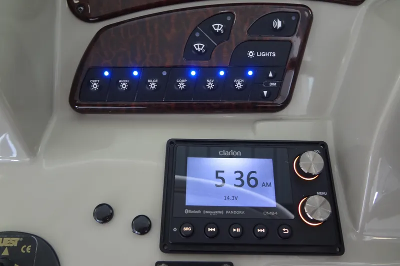 Slide: The Image of Control panel of a 2013 Sea Ray Sundancer 330 boat with Clarion audio system. - 29