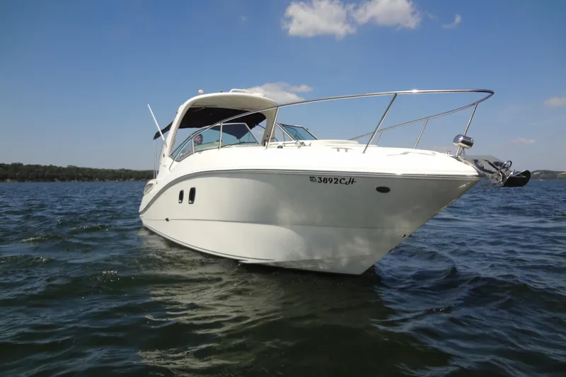 The Image of 2013 Sea Ray Sundancer 330 cruising on a sunny day in open waters. - 0