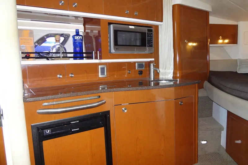 Slide: The Image of Interior of 2013 Sea Ray Sundancer 330 yacht with kitchenette and bed. - 41