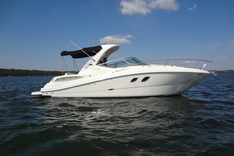 Slide: The Image of 2013 Sea Ray Sundancer 330 cruising on a sunny day with clear blue skies. - 2