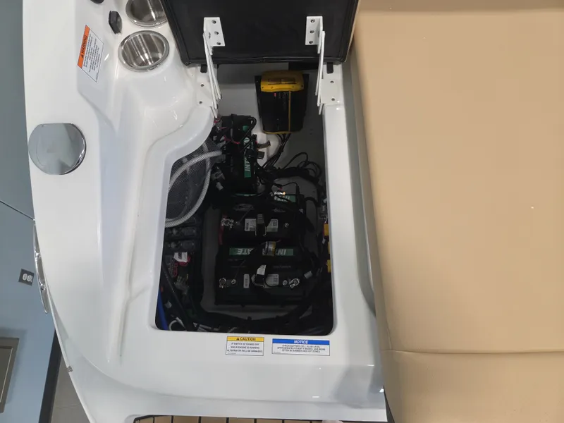 Slide: The Image of An open compartment on a Sea Ray SDX 270 Surf boat reveals batteries and wiring. - 38