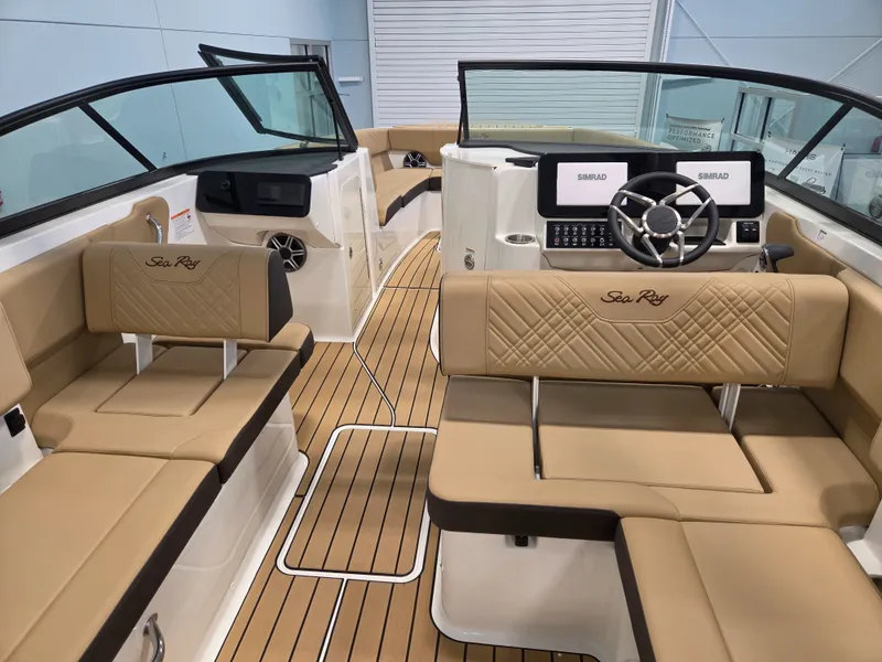 Slide: The Image of The image shows the interior of a Sea Ray SDX 270 Surf boat with sleek seating and modern features. - 17