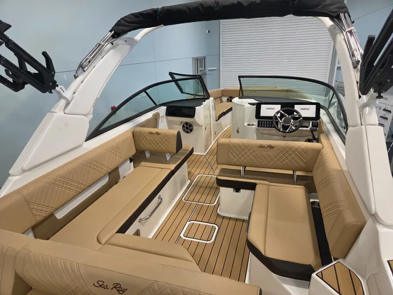 Slide: The Image of The image shows the interior of a Sea Ray SDX 270 Surf boat with sleek seating and modern features. - 12
