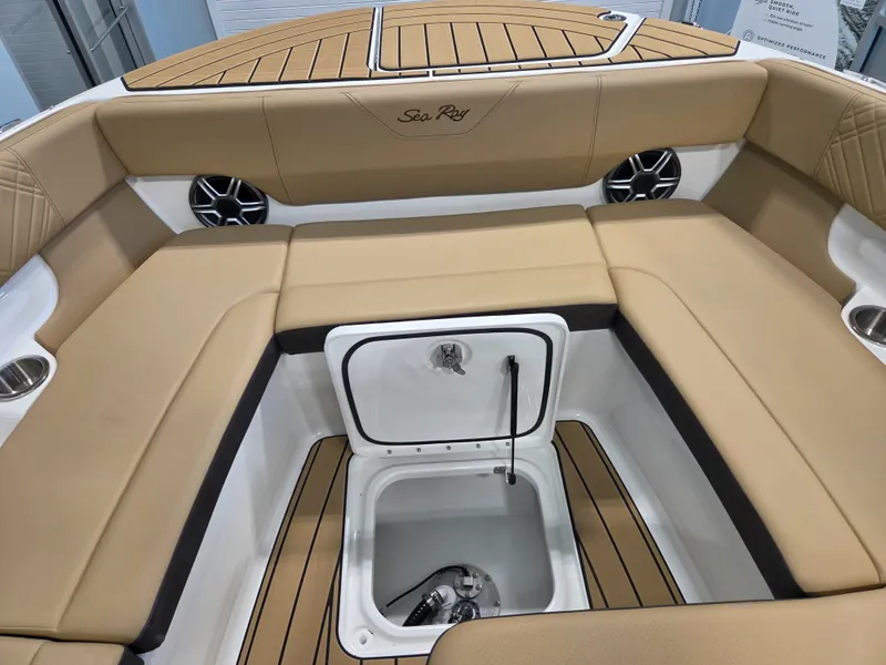 Slide: The Image of The image shows the bow area of a 2027 Sea Ray SDX 270 Surf with beige upholstery. - 26