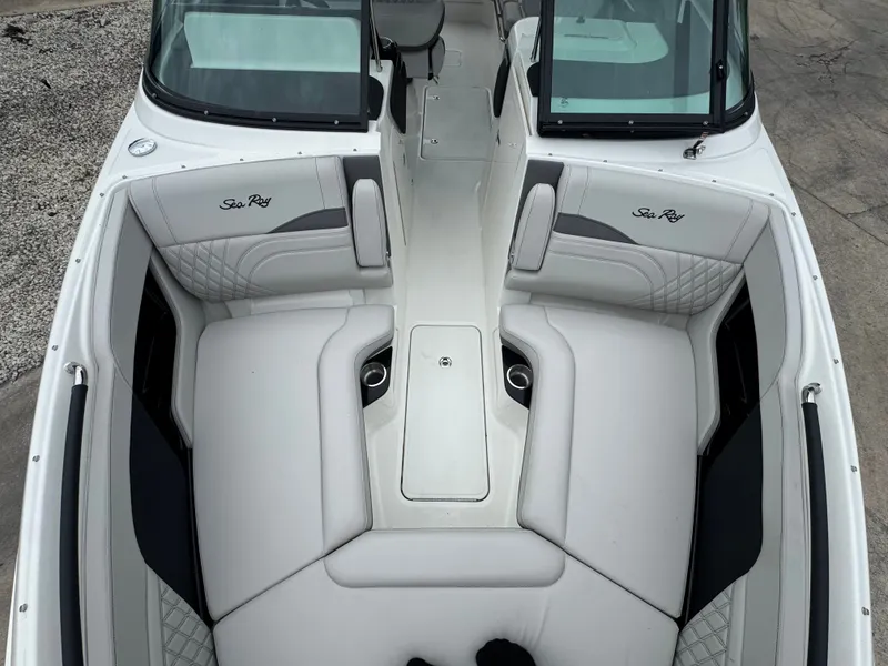 Slide: The Image of The image shows the cockpit of a 2027 Sea Ray SLX 280 Outboard with luxurious white seating. - 17