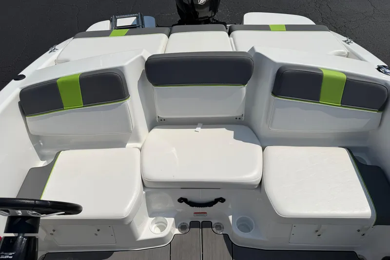 Slide: The Image of 2024 Tahoe T16 boat interior with gray and green cushioned seating. - 7