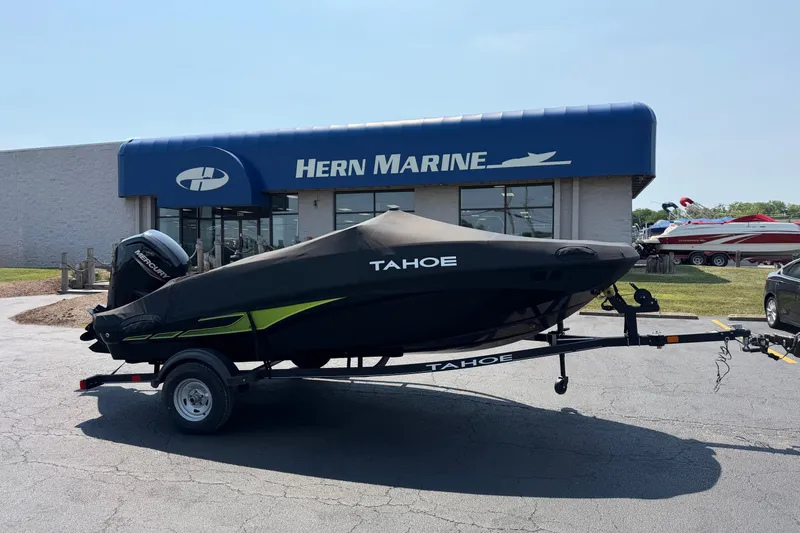 Slide: The Image of 2024 Tahoe T16 boat on trailer outside Hern Marine dealership. - 1