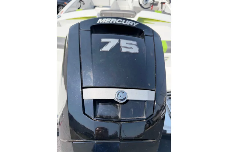 Slide: The Image of Mercury 75 horsepower engine on 2024 Tahoe T16 boat, close-up view. - 9