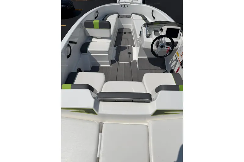 Slide: The Image of 2024 Tahoe T16 boat interior with modern seating and steering console. - 2