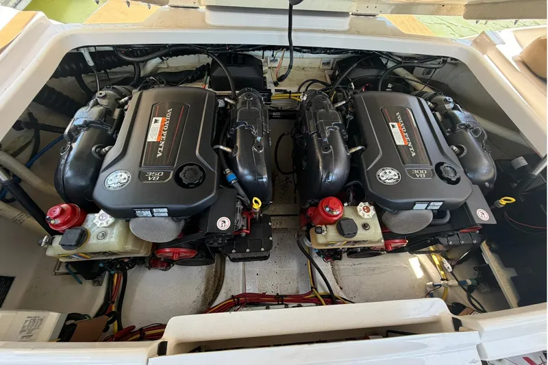 Slide: The Image of Engine compartment of a 2016 Four Winns H290 boat with dual Volvo Penta engines. - 16