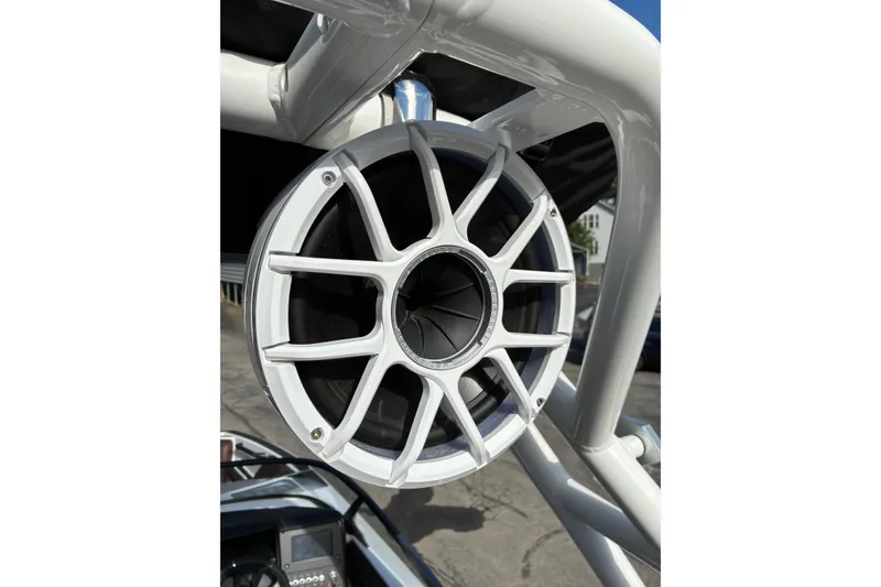 Slide: The Image of Close-up of a 2025 Moomba Max boat speaker with white grille design. - 47