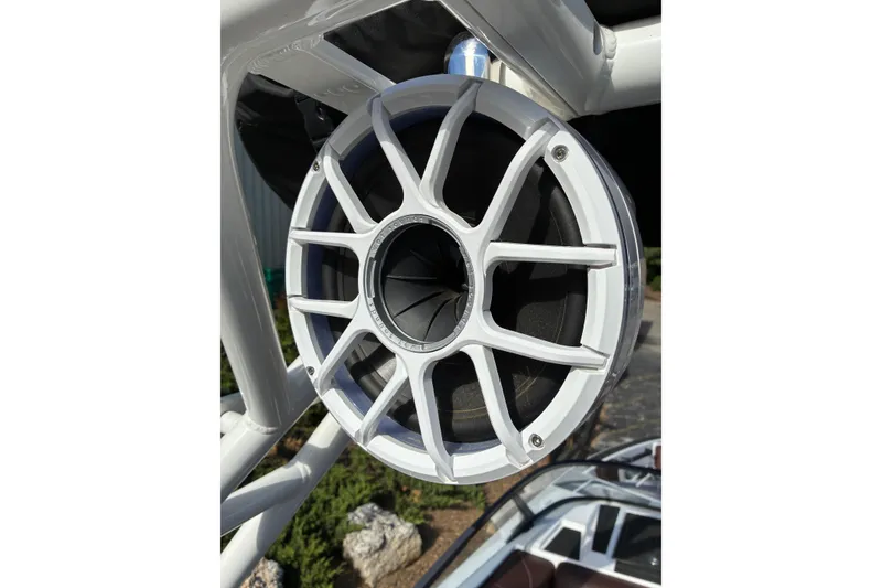 Slide: The Image of Close-up of a 2025 Moomba Max boat speaker with a sleek white grille design. - 48