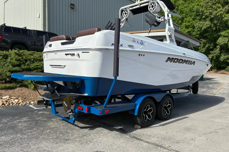 Slide: The Image of 2025 Moomba Max boat on trailer, featuring sleek design and modern features. - 4