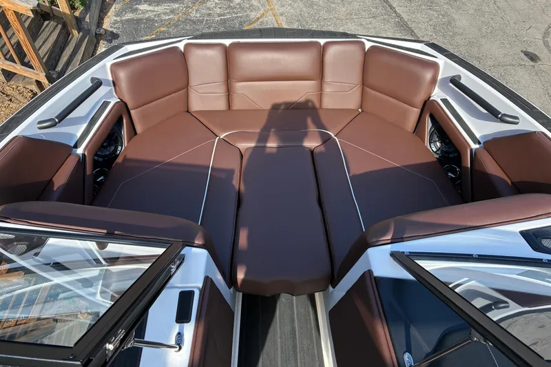 Slide: The Image of 2025 Moomba Max boat interior with brown leather seating and modern design. - 42