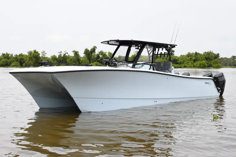 Slide: The Image of 2024 Front Runner 37 Catamaran on calm water, showcasing sleek design and modern features. - 5