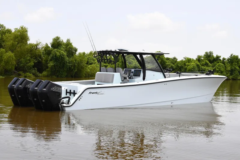 Slide: The Image of 2024 Front Runner 37 Catamaran with quad engines on a calm river. - 8