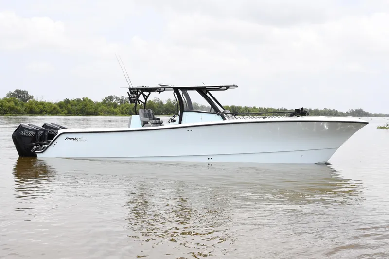 Slide: The Image of 2024 Front Runner 37 Catamaran on calm water, showcasing sleek design and powerful engines. - 9