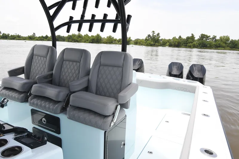 Slide: The Image of 2024 Front Runner 37 Catamaran with luxurious seating and powerful outboard engines on a serene river. - 15