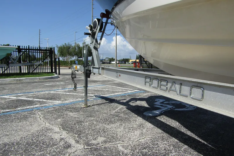 Slide: The Image of 2018 Robalo R202 Explorer boat on trailer in parking lot. - 10