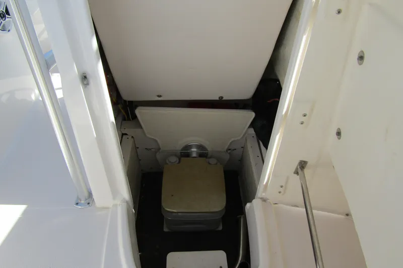 Slide: The Image of 2018 Robalo R202 Explorer boat interior with compact toilet compartment. - 19