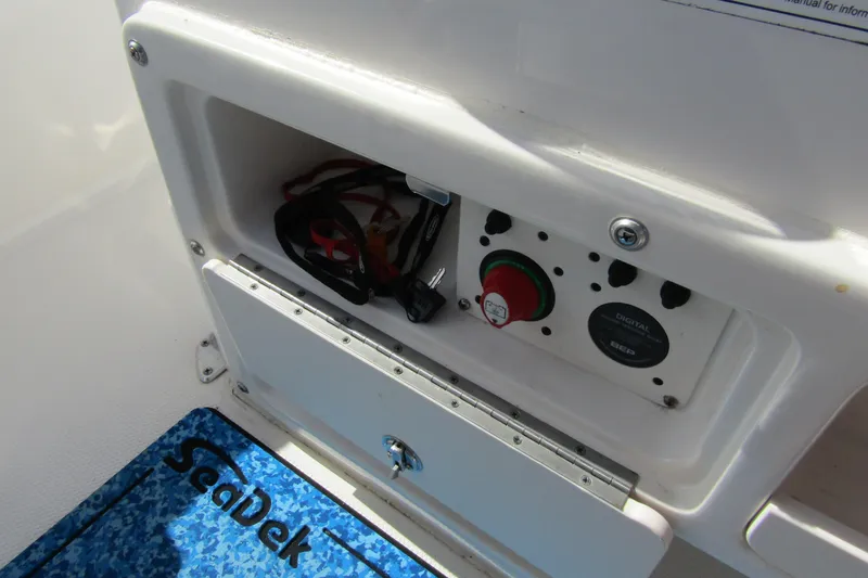 Slide: The Image of Control panel of a 2018 Robalo R202 Explorer boat with SeaDek flooring. - 27