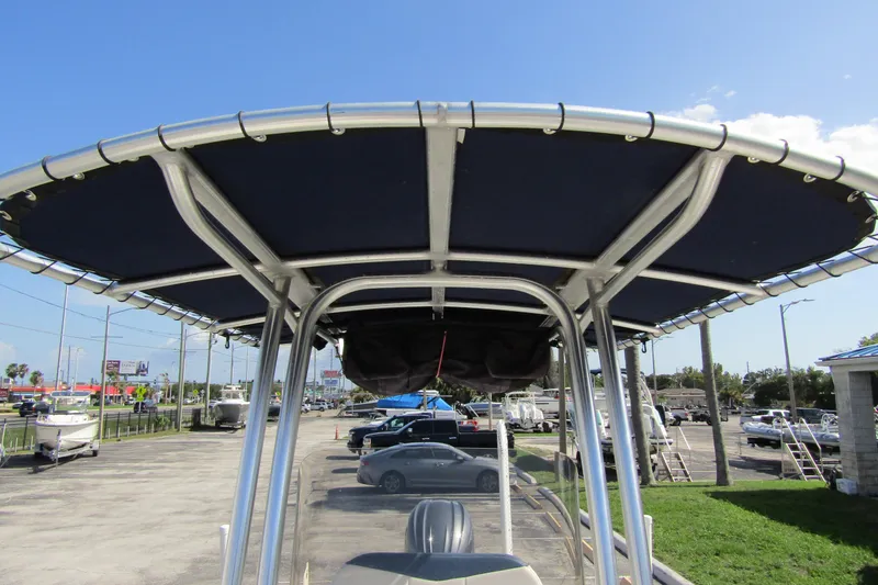 Slide: The Image of 2018 Robalo R202 Explorer boat with T-top canopy in a parking lot. - 21