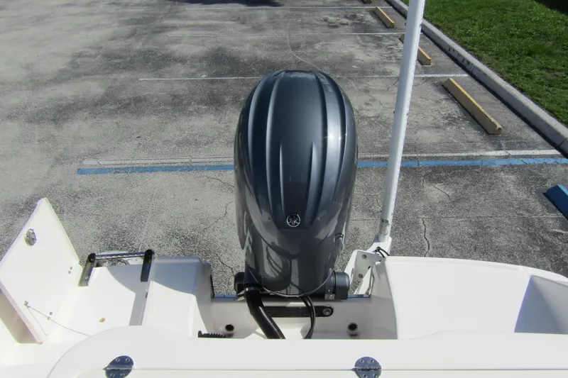 Slide: The Image of 2018 Robalo R202 Explorer boat with outboard motor in parking lot. - 36