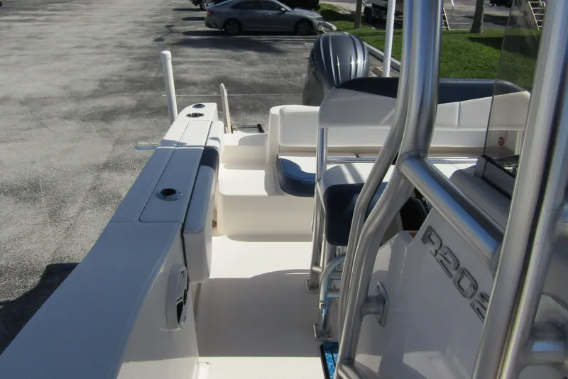 Slide: The Image of 2018 Robalo R202 Explorer boat interior with seating and console details. - 23