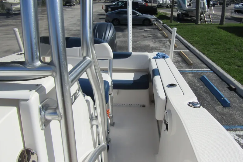 Slide: The Image of 2018 Robalo R202 Explorer boat interior with seating and stainless steel features. - 24