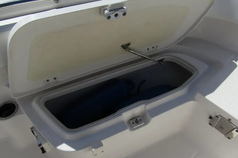 Slide: The Image of Open storage compartment on a 2018 Robalo R202 Explorer boat. - 15