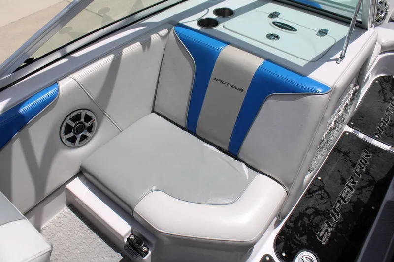 Slide: The Image of Interior of a 2008 Nautique 210 Team with blue and gray upholstery. - 8