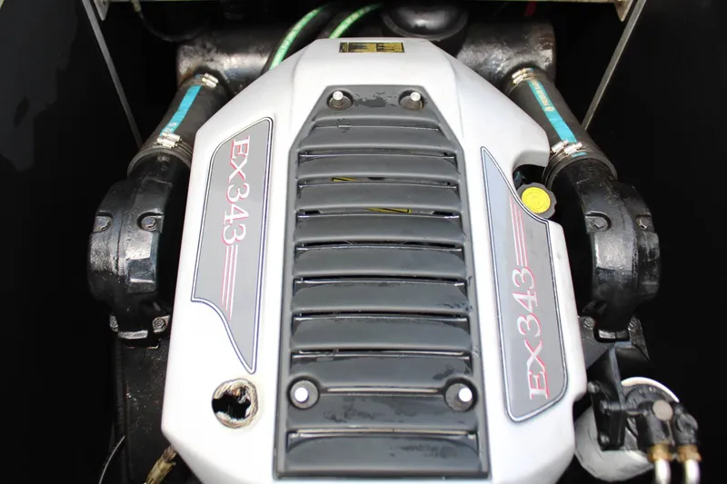Slide: The Image of Close-up of a boat engine with "EX343" written on the cover. - 13