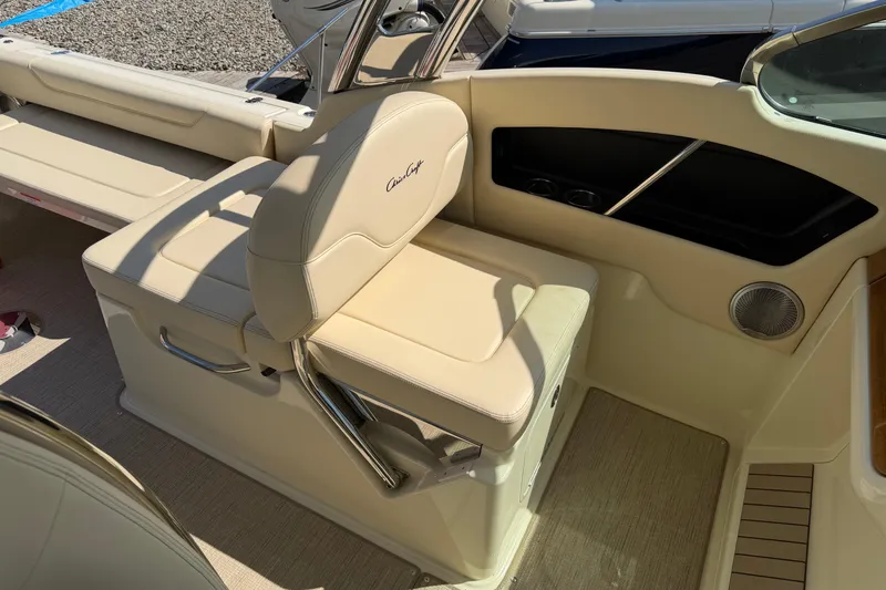 Slide: The Image of 2027 Chris-Craft Calypso 28 boat interior with beige seating and sleek design. - 25