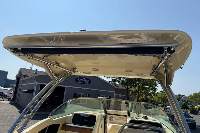 Slide: The Image of 2027 Chris-Craft Calypso 28 boat with sleek canopy and modern design. - 24
