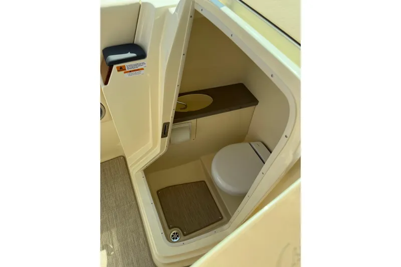 Slide: The Image of 2027 Chris-Craft Calypso 28 boat interior with compact bathroom and toilet. - 20