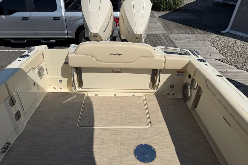 Slide: The Image of 2027 Chris-Craft Calypso 28 boat interior with seating and Mercury engines. - 36
