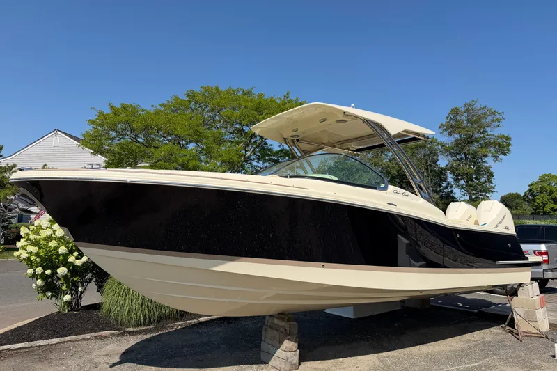 The Image of 2027 Chris-Craft Calypso 28 boat displayed outdoors on a sunny day. - 0