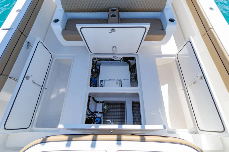 Slide: The Image of 2025 Valhalla Boatworks V-46 deck with open storage compartments and seating. - 10