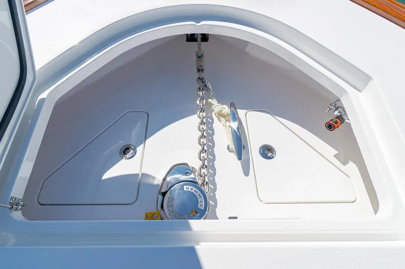 Slide: The Image of Anchor compartment of 2025 Valhalla Boatworks V-46, featuring chain and storage. - 32