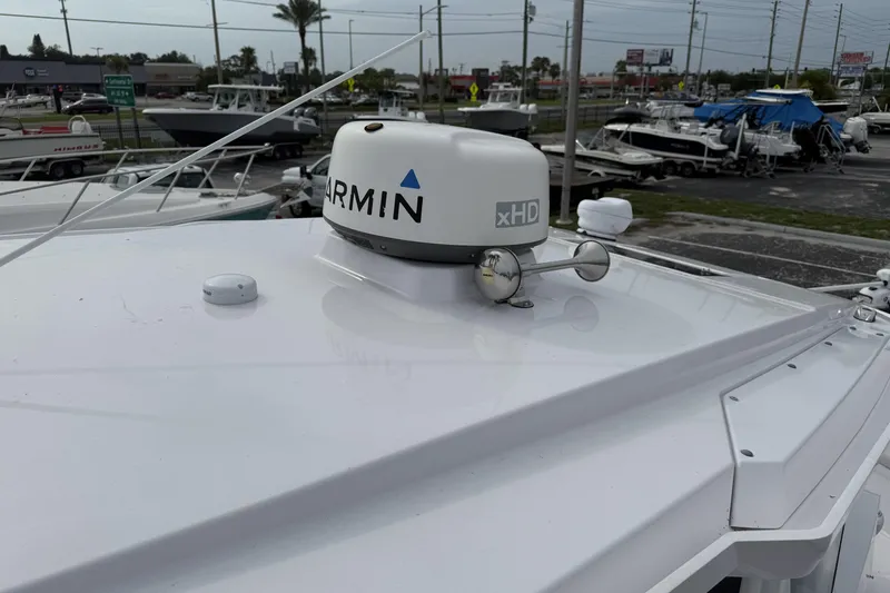 Slide: The Image of 2025 Axopar 29 CCX boat with Garmin xHD radar on deck. - 9