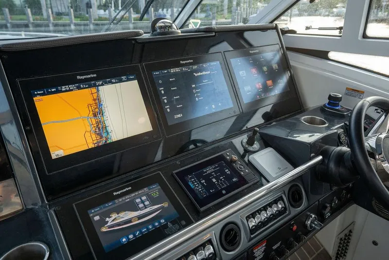 Slide: The Image of The cockpit of the 2018 Formula 430 Super Sport Crossover features modern navigation and control systems. - 49