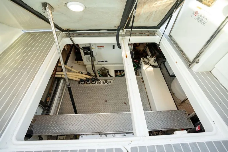 Slide: The Image of The engine compartment of a 2018 Formula 430 Super Sport Crossover with a Kohler generator and tidy layout. - 39