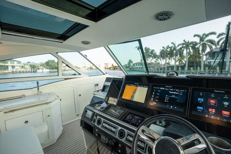 Slide: The Image of The cockpit of a 2018 Formula 430 Super Sport Crossover with modern navigation systems and panoramic windows. - 50