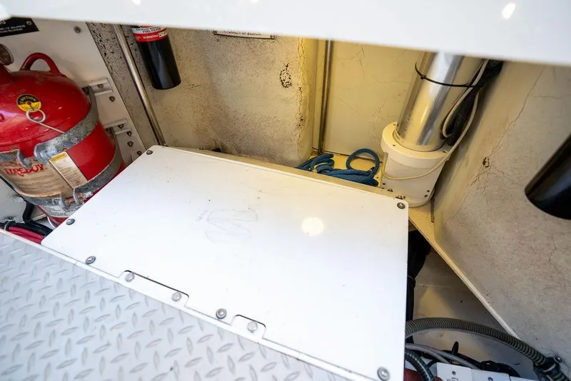 Slide: The Image of A view of the engine compartment with a fire extinguisher and piping. - 41