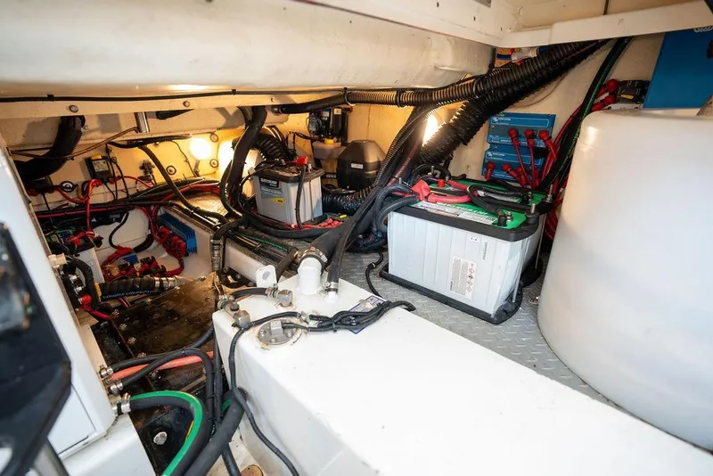 Slide: The Image of The engine room of a 2018 Formula 430 Super Sport Crossover with batteries and wiring. - 42