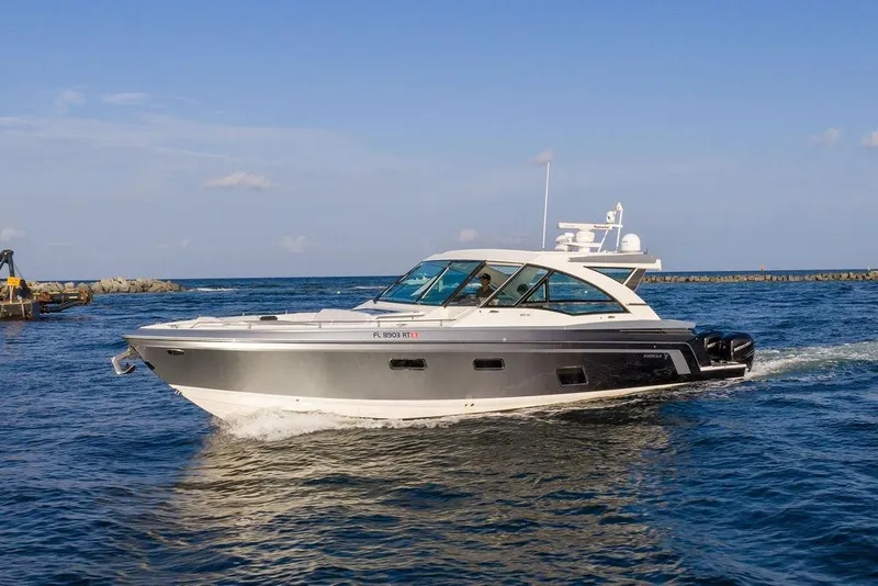 Slide: The Image of The 2018 Formula 430 Super Sport Crossover cruising on calm waters with a clear sky backdrop. - 17
