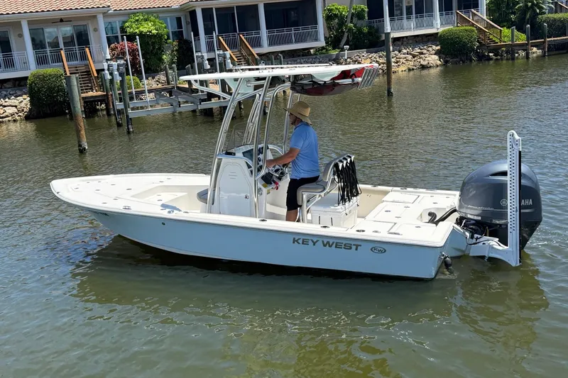 The Image of 2023 Key West 239 DFS boat on water near waterfront homes. - 1