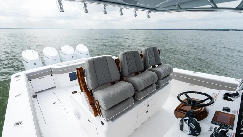 Slide: The Image of 2025 Valhalla Boatworks V-41 with luxurious seating and multiple engines on open water. - 33