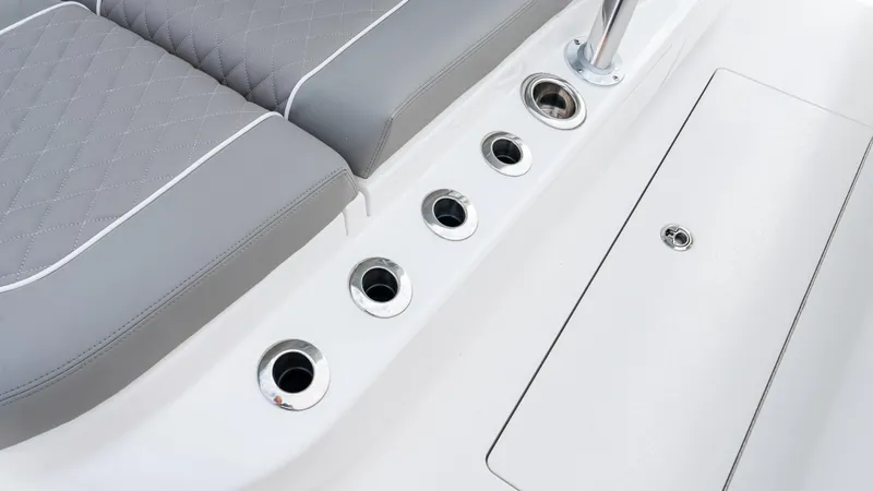 Slide: The Image of 2025 Valhalla Boatworks V-41 interior with gray seating and stainless steel cup holders. - 43